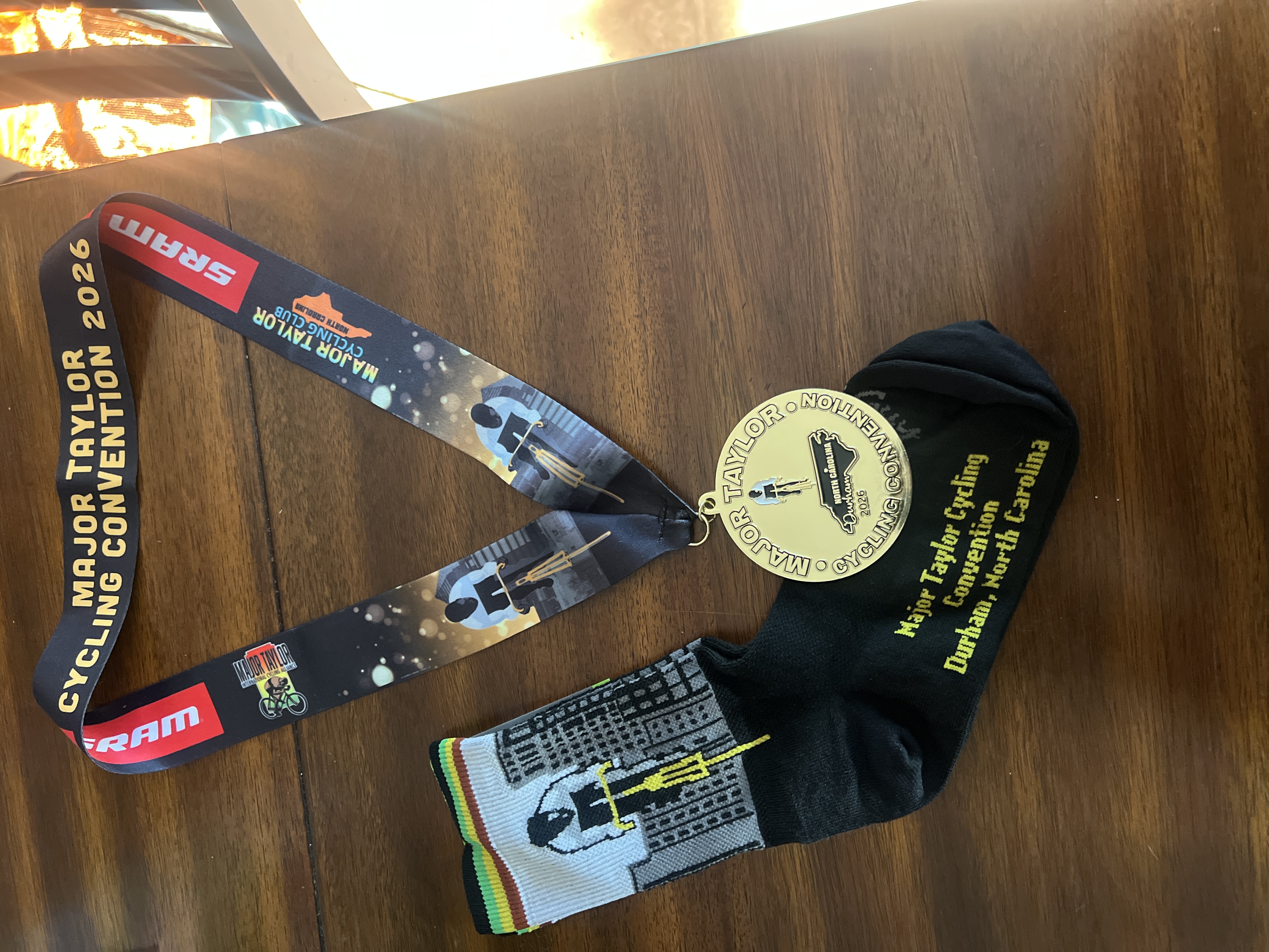 2026 MTICA Major Taylor Cycling Convention finisher medal on SRAM lanyard with custom Durham socks