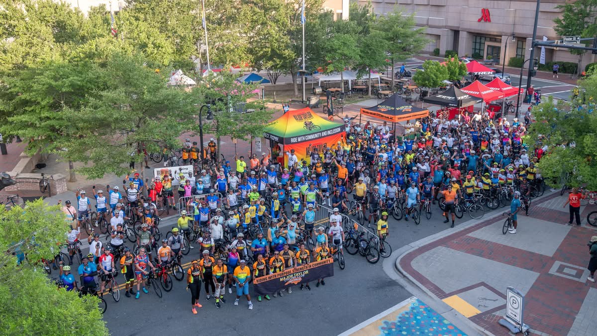 Aerial view of hundreds of cyclists gathered at CCB Plaza for the Saturday morning wave start at the MTICA 2026 Convention in Durham NC