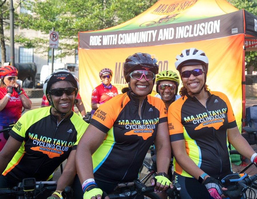 Three Major Taylor Cycling Club members in club kit at the start of a ride in Durham